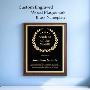 Custom engraved wood plaque with brass nameplate on a blue wall