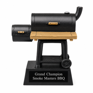 Black and wooden BBQ smoker with 'Grand Champion Smoke Masters BBQ' plaque on a white background
