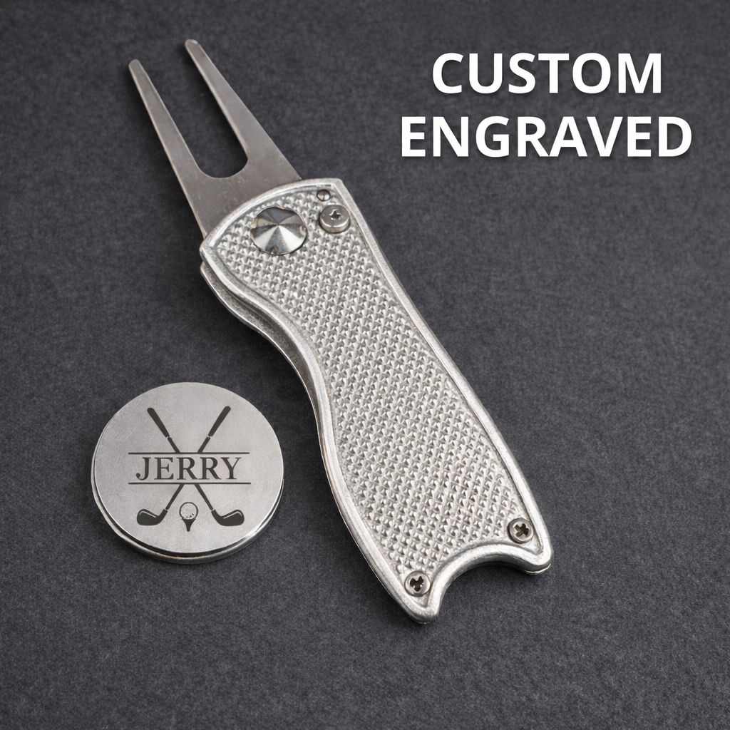 Custom engraved golf divot tool with a personalized tag on a dark background