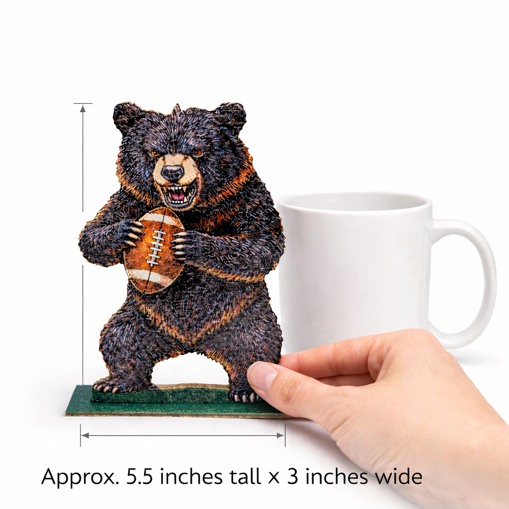 Bear figurine holding a football next to a mug with dimensions displayed