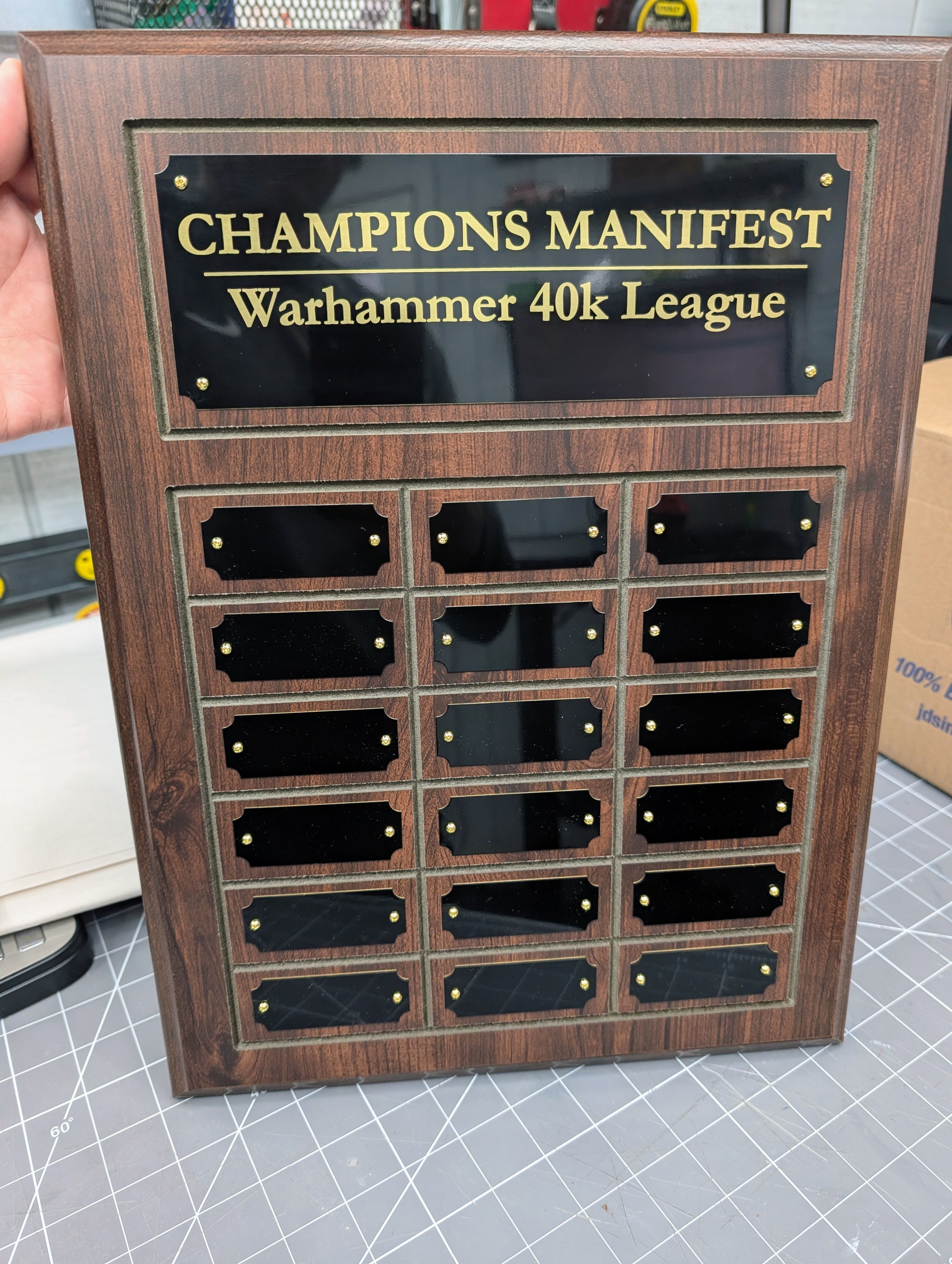 Cherry wooden plaque with engraved names.